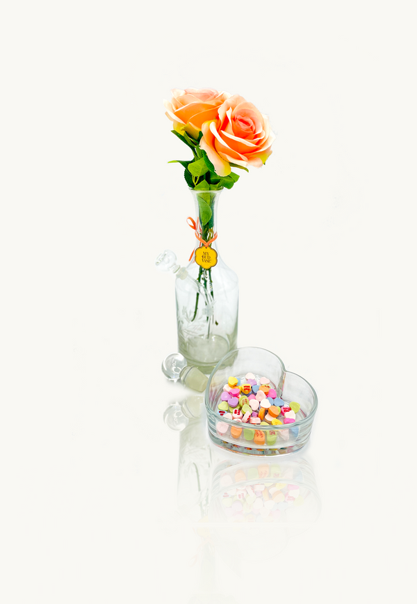 Photo of My Bud Vase Blushed Heart Bong with heart shaped ashtray, bent downstem, percolator and floral bouquet.