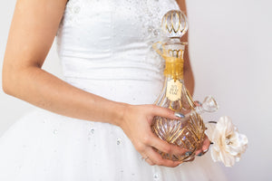 Beautiful bride is holding a gorgeous crystal premium bong with 24 karat gold accents from My Bud Vase