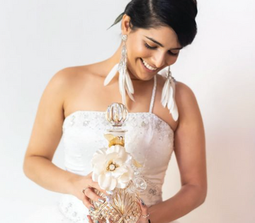 Beautiful Bride in a wedding dress holding a premium bong that is 14 carat gold crystal.