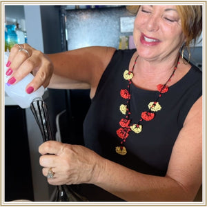 Doreen smiling cleaning vintage bong with vinegar and lemon juice