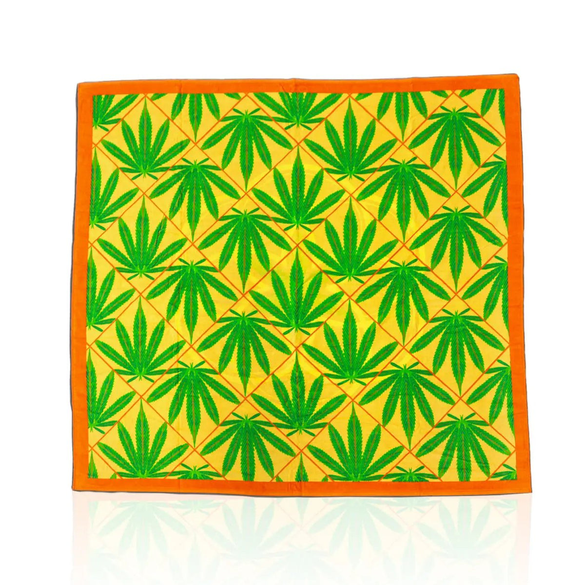 Luxurious big beach towel with bright colors and green bud leaves. 